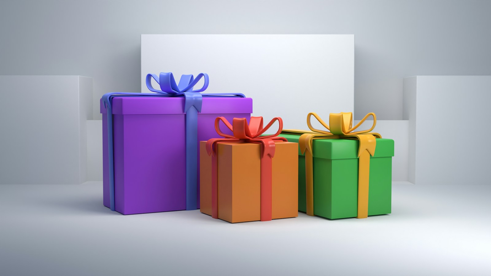 Three colorful gift boxes with ribbons