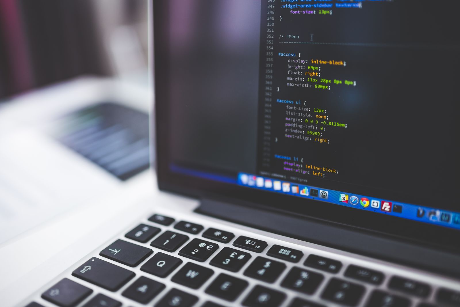 Laptop screen showing CSS code
